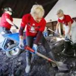 Bucket brigade shoveling mud